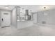 Bright, open kitchen with a large island, modern stainless steel appliances, and tiled floors at 1586 Linwood Dr, Clearwater, FL 33755