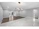 Spacious living room featuring new floors, modern lighting, and fresh, neutral paint, offering a bright and airy atmosphere at 1586 Linwood Dr, Clearwater, FL 33755