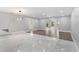 Open concept living space with tiled floors and a seamless transition to an adjacent room at 1586 Linwood Dr, Clearwater, FL 33755