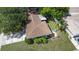 Aerial view of the single-Gathering home featuring a fenced backyard with seating at 1711 N Highland Ave, Clearwater, FL 33755