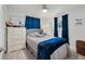 Bedroom with decor, dresser, ceiling fan, and window offering plenty of natural light at 1711 N Highland Ave, Clearwater, FL 33755