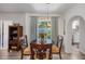 Dining area with dark table and wood shelving unit at 1711 N Highland Ave, Clearwater, FL 33755