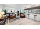 Cozy living room with leather furniture, stylish decor, and an open layout leading to the kitchen at 1711 N Highland Ave, Clearwater, FL 33755