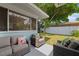 Serene outdoor patio with comfortable seating and a well-manicured lawn creating a peaceful retreat at 1711 N Highland Ave, Clearwater, FL 33755