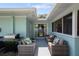 Spacious covered patio with comfortable seating and a barbecue grill, ideal for outdoor entertaining at 1711 N Highland Ave, Clearwater, FL 33755