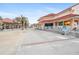 Waterfront view of the promenade featuring pedestrian areas, palm trees, and a building with decorative architecture at 1711 N Highland Ave, Clearwater, FL 33755