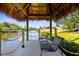 Charming waterfront dock featuring comfortable seating and tranquil canal views, perfect for relaxation at 18093 Ohara Dr, Port Charlotte, FL 33948