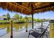 Relaxing waterfront tiki hut on a canal providing serene views and a peaceful retreat at 18093 Ohara Dr, Port Charlotte, FL 33948