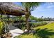 Waterfront tiki hut, perfect for entertaining and relaxing with a scenic water view at 18093 Ohara Dr, Port Charlotte, FL 33948