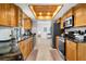 Spacious kitchen with wood cabinets, granite countertops, and stainless steel appliances at 18093 Ohara Dr, Port Charlotte, FL 33948
