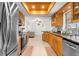 Bright eat-in kitchen with wood cabinets, granite counters, and stainless steel appliances at 18093 Ohara Dr, Port Charlotte, FL 33948