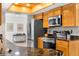 Well-equipped kitchen with modern appliances, granite countertops, and warm wood cabinetry at 18093 Ohara Dr, Port Charlotte, FL 33948