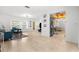 Open-concept living space with tile floors, modern furnishings, and ample natural light at 18093 Ohara Dr, Port Charlotte, FL 33948