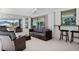 Covered patio featuring a bar area and wicker furniture for relaxed outdoor living and entertaining at 18093 Ohara Dr, Port Charlotte, FL 33948