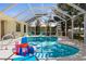 Enclosed pool with clear blue water, offering a refreshing oasis for relaxation and Gathering fun at 18093 Ohara Dr, Port Charlotte, FL 33948