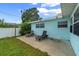 Home backyard with a patio, lawn and chairs at 1825 Welland Dr, Clearwater, FL 33756