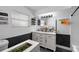 Contemporary bathroom featuring a dual sink vanity, black hardware, and stylish design at 1825 Welland Dr, Clearwater, FL 33756
