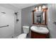 Standard bathroom featuring a shower-tub combo, single sink vanity, and neutral colors at 1825 Welland Dr, Clearwater, FL 33756