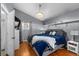 Primary bedroom boasting stylish décor, natural light, and hardwood floors at 1825 Welland Dr, Clearwater, FL 33756