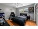 Bedroom with laminate flooring, a ceiling fan, and a good amount of natural light at 1825 Welland Dr, Clearwater, FL 33756