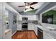 Contemporary kitchen with stainless steel appliances, and ample cabinet space at 1825 Welland Dr, Clearwater, FL 33756