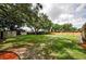 Expansive backyard with storage sheds and ample space for outdoor activities at 1893 Harding St, Clearwater, FL 33765