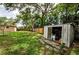 Spacious backyard with a storage shed and lush green grass at 1893 Harding St, Clearwater, FL 33765
