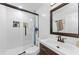 Stylish bathroom featuring a glass-enclosed shower and modern vanity at 1893 Harding St, Clearwater, FL 33765