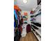Walk-in closet with organized shelving and storage, providing ample space for clothes and accessories at 1893 Harding St, Clearwater, FL 33765
