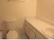 Clean bathroom features a toilet, vanity, and sink providing a functional and pleasant space at 201 Faithway Dr, Seffner, FL 33584