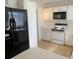 A well-equipped kitchen features appliances and ample cabinet space for organized storage and functionality at 201 Faithway Dr, Seffner, FL 33584