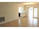 The open-concept layout is enhanced by tile flooring and is complemented by an elegant chandelier and lots of light at 201 Faithway Dr, Seffner, FL 33584