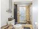 Bathroom with tiled shower, glass block window, pebble floor and modern fixtures at 23067 Brighton Pl, Land O Lakes, FL 34639