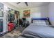 Well-organized bedroom featuring a closet, a desk, and bed with modern ceiling fan at 23067 Brighton Pl, Land O Lakes, FL 34639