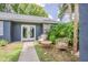 Cozy front porch with outdoor seating, perfect for relaxing, featuring a well-manicured garden at 23067 Brighton Pl, Land O Lakes, FL 34639
