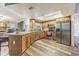 Bright kitchen features wood cabinets, granite countertops, and stainless steel appliances at 23067 Brighton Pl, Land O Lakes, FL 34639
