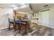 Kitchen with breakfast bar seating, stainless appliances, skylight and wood flooring at 23067 Brighton Pl, Land O Lakes, FL 34639