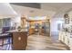 Spacious kitchen with breakfast bar, wood cabinets, stainless appliances and wood flooring at 23067 Brighton Pl, Land O Lakes, FL 34639