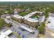 Aerial view of condo building, showing parking, carports and community pool at 2525 W Bay Dr # A46, Largo, FL 33770