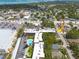 Aerial view of a neighborhood with a pool and an arrow pointing to the building at 2525 W Bay Dr # A46, Largo, FL 33770