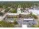 Aerial view of condo building shows parking and mature trees at 2525 W Bay Dr # A46, Largo, FL 33770