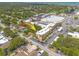 Aerial view of the condo shows the building and parking area, surrounded by mature trees at 2525 W Bay Dr # A46, Largo, FL 33770