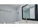 Modern bathroom features a granite countertop and decorative framed mirror at 2525 W Bay Dr # A46, Largo, FL 33770
