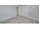 Bedroom with gray floors, a closet, neutral walls, and white trim at 2525 W Bay Dr # A46, Largo, FL 33770