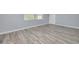 Bright bedroom features hardwood floors and natural light from a window at 2525 W Bay Dr # A46, Largo, FL 33770