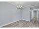 Open dining room with modern lighting and hardwood floors at 2525 W Bay Dr # A46, Largo, FL 33770
