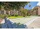 Shuffleboard in community surrounded by landscaped grounds and palm trees at 2525 W Bay Dr # A46, Largo, FL 33770
