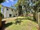 Spacious backyard featuring a privacy fence and lush greenery, perfect for outdoor activities at 2612 E 26Th Ave, Tampa, FL 33605