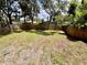 Large fenced backyard with mature trees providing ample shade and privacy for relaxation at 2612 E 26Th Ave, Tampa, FL 33605