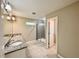 Bathroom with granite countertops, tile floors, double sinks and frameless glass shower at 2612 E 26Th Ave, Tampa, FL 33605